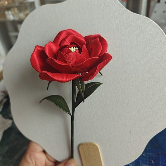 Luxury 3D embroidery decorative rose ornament made with intricate artisanal thread-wrapping techniques.