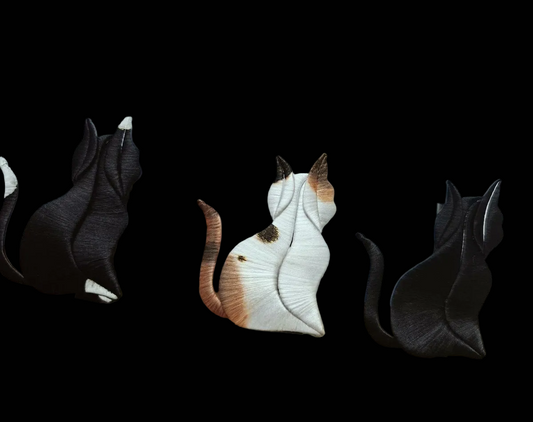Close-up of handmade thread-wrapped feline pins showing the intricate 3D texture and traditional Chanhua craftsmanship.