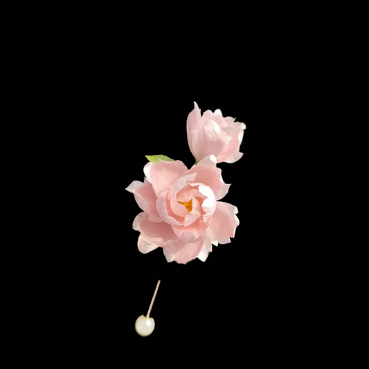 Handcrafted Ronghua Pink Peony brooch featuring soft velvet-textured silk petals with a detailed yellow stamen.