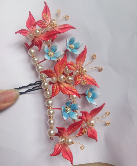 3D bridal hair accessory with intricate butterfly and floral designs made using traditional thread-wrapping techniques.