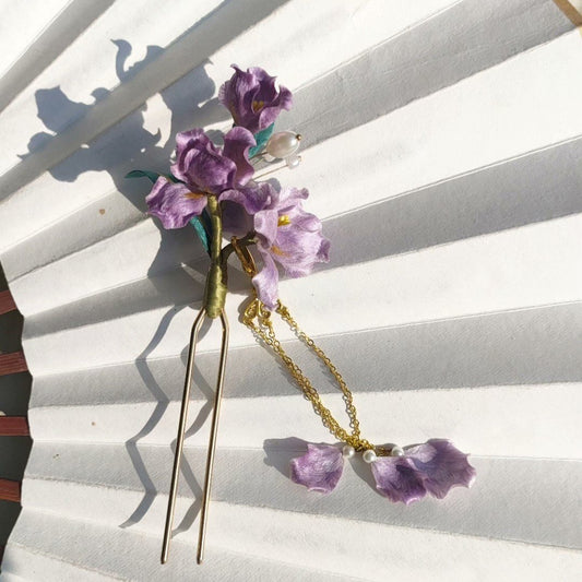 3D silk velvet floral hair accessory featuring purple iris clusters and pearl accents on a gold-tone U-pin.
