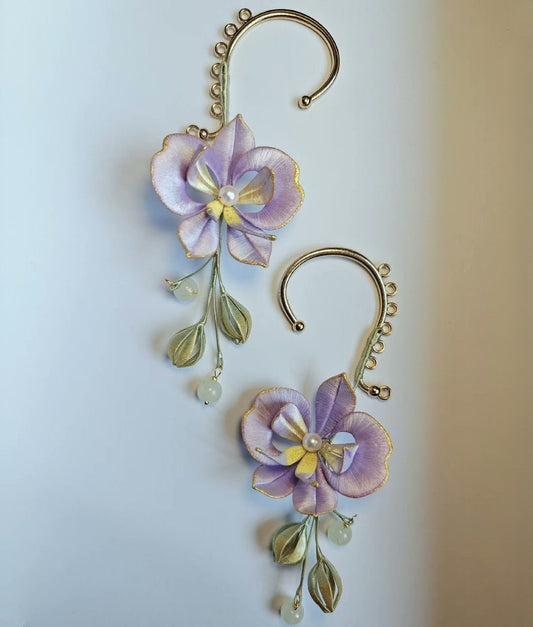 3D floral ear jewelry depicting blooming Phalaenopsis orchids made with traditional artisanal thread-wrapping.