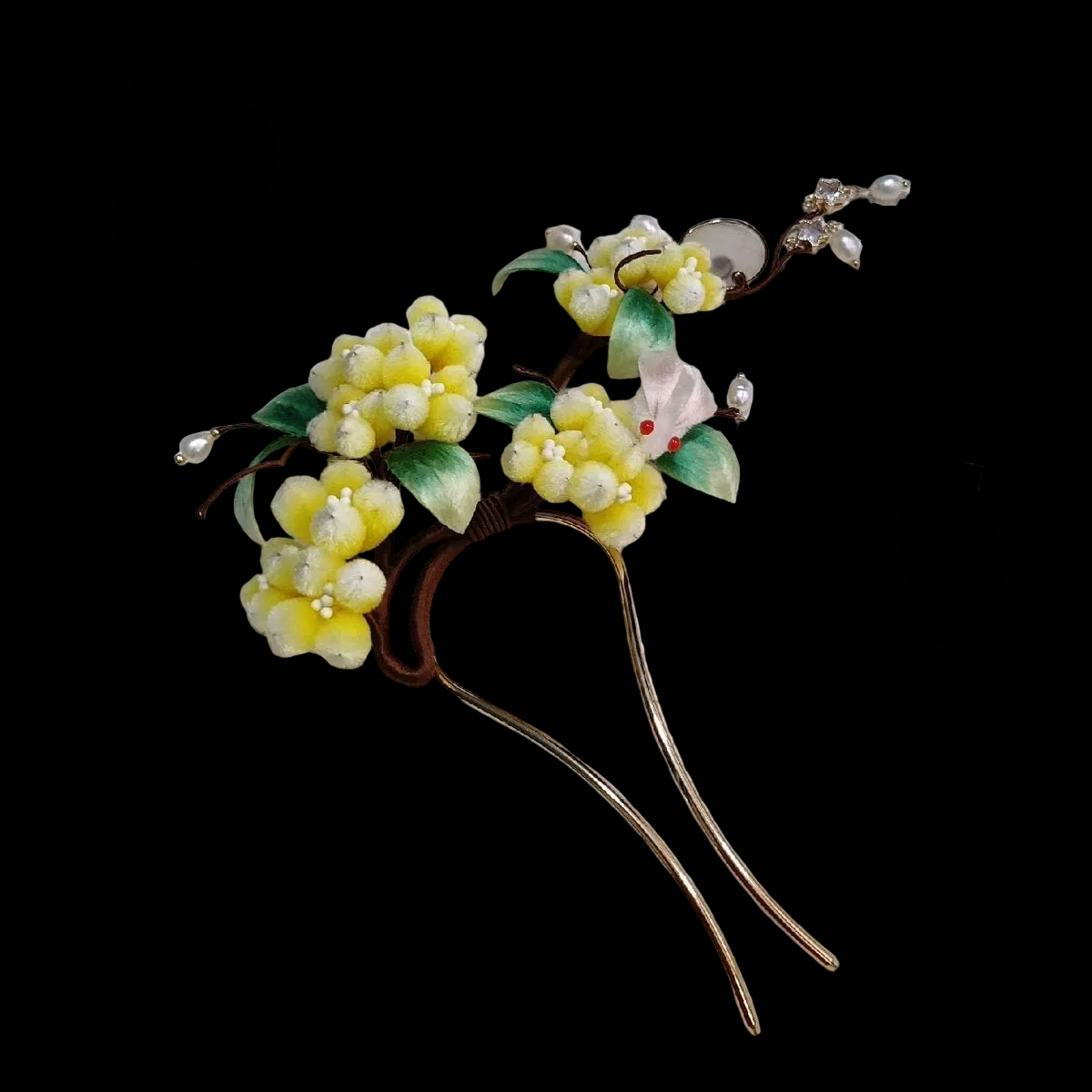 Close-up of yellow silk velvet osmanthus flowers with green leaves and moon rabbit detail on Ronghua hairpin