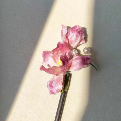 3D silk velvet flower hair accessory depicting a blooming pink iris made with traditional artisanal Ronghua techniques.