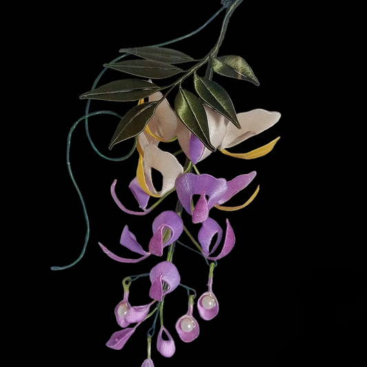 Handcrafted Chanhua wisteria wall art in a wooden frame featuring purple and white thread-wrapped flowers.