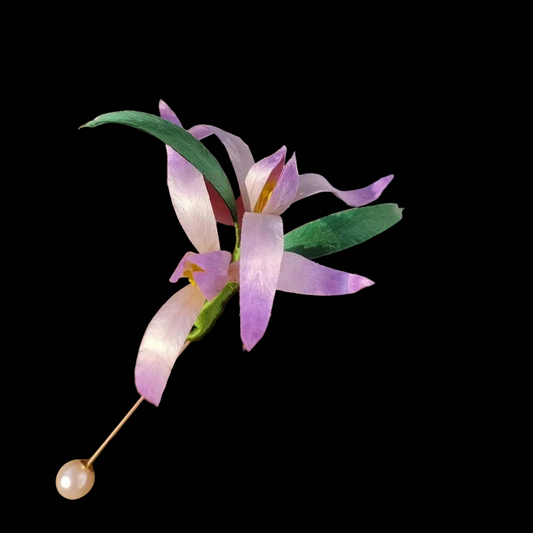 Handcrafted purple Iris Ronghua brooch with velvet-textured silk petals and pearl accents on a gold-tone pin.