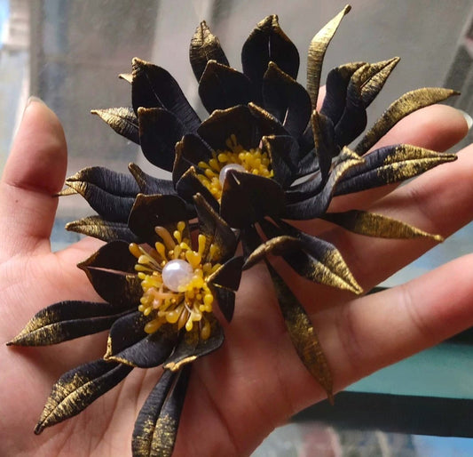 3D floral accessory depicting a blooming "Queen of the Night" flower made with intricate artisanal thread-wrapping.