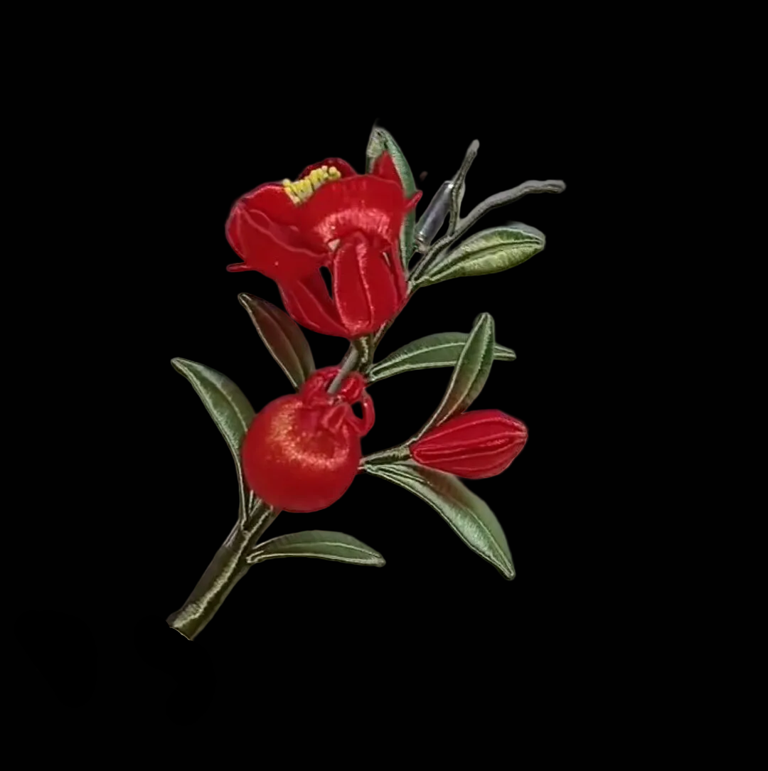 Handcrafted Chanhua thread-wrapped brooch featuring a red flower, green immortal grass leaves, and a blue butterfly with a hanging bead accent.