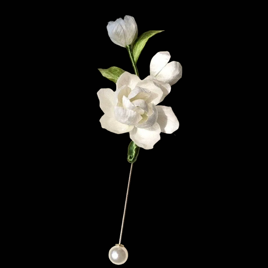 Handcrafted white Jasmine Ronghua brooch featuring soft velvet-textured silk petals and a pearl drop on a long gold-tone pin.