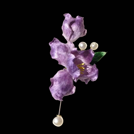 Handcrafted purple Iris Ronghua brooch with velvet-textured silk petals and pearl accents on a gold-tone pin.