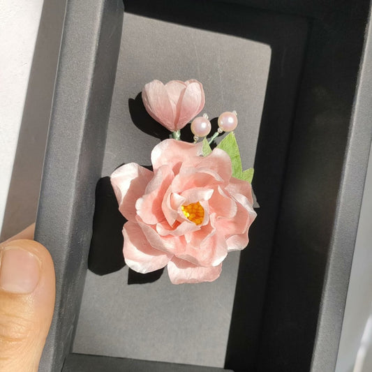 3D silk velvet flower pin depicting a blooming Hibiscus made with traditional artisanal Ronghua techniques.
