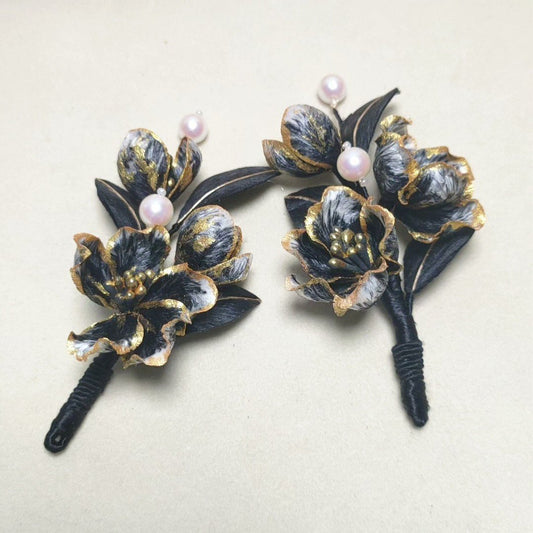 3D silk velvet floral hair ornament featuring black and gold blossoms made with traditional artisanal Ronghua techniques.