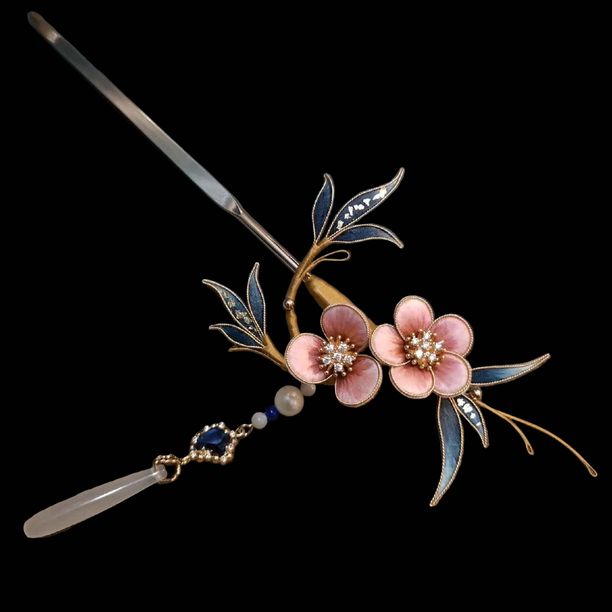 Close-up of pink silk velvet plum blossoms with blue leaves and crystal details on Ronghua hairpin