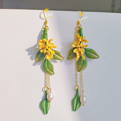 Elegant Chanhua floral earrings showcasing yellow osmanthus blossoms, green foliage, and natural pearl drops, handcrafted with 925 silver hooks.