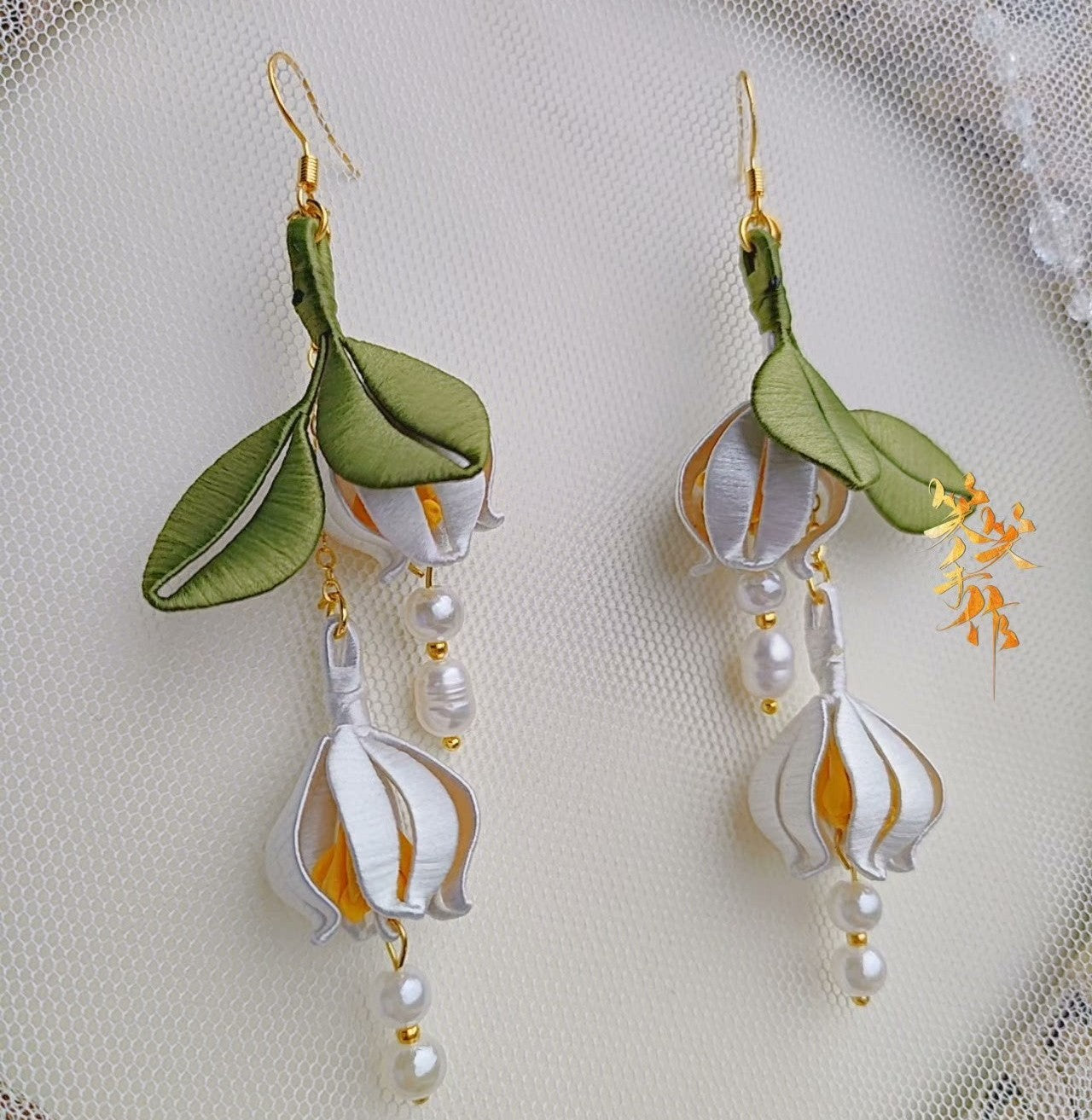 Handcrafted Chanhua flower drop earrings with white silk petals and natural freshwater pearls on 925 silver hooks, showcasing intricate detail for SEO.