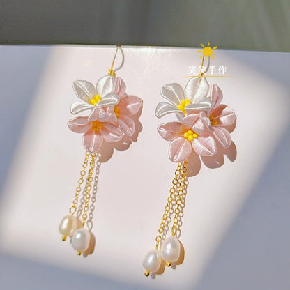Handcrafted pink and white Chanhua flower dangle earrings with natural freshwater pearls and 925 silver hooks.