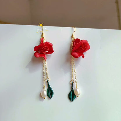 Pair of elegant handmade Chanhua red rose and freshwater pearl earrings, showcasing the delicate craftsmanship and vibrant colors, suitable for formal and casual wear.