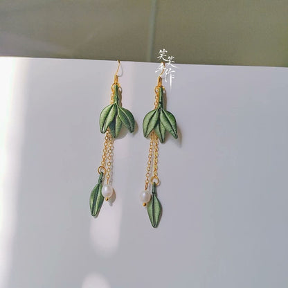 Elegant long dangle earrings, handmade with intricate green embroidery and white natural pearls, ideal for daily wear or special occasions.