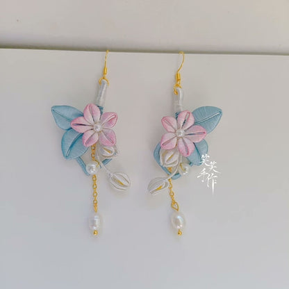 Elegant pink Chanhua flower and blue leaf earrings with dangling pearls, showcasing artisan craftsmanship.