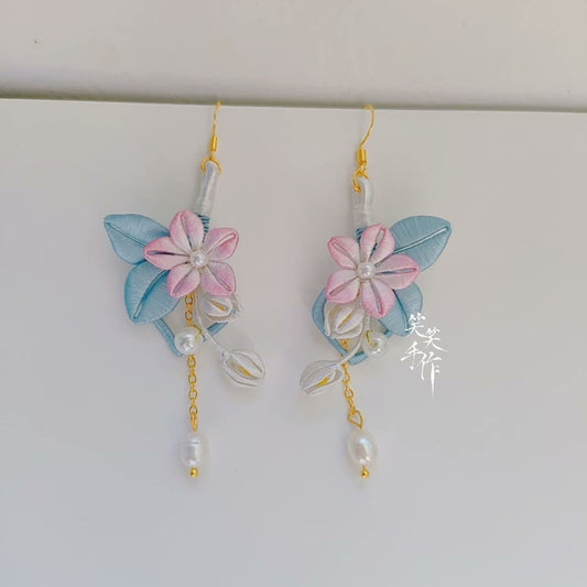 Elegant pink Chanhua flower and blue leaf earrings with dangling pearls, showcasing artisan craftsmanship.