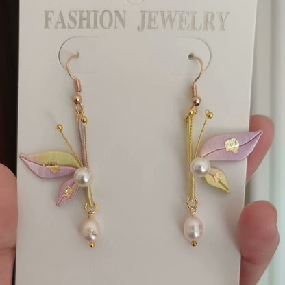 Unique handmade Chanhua earrings with pastel purple and yellow silk wings and pearl drops.