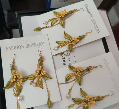 A collection of handmade Chanhua flower earrings displayed on white "Fashion Jewelry" cards.