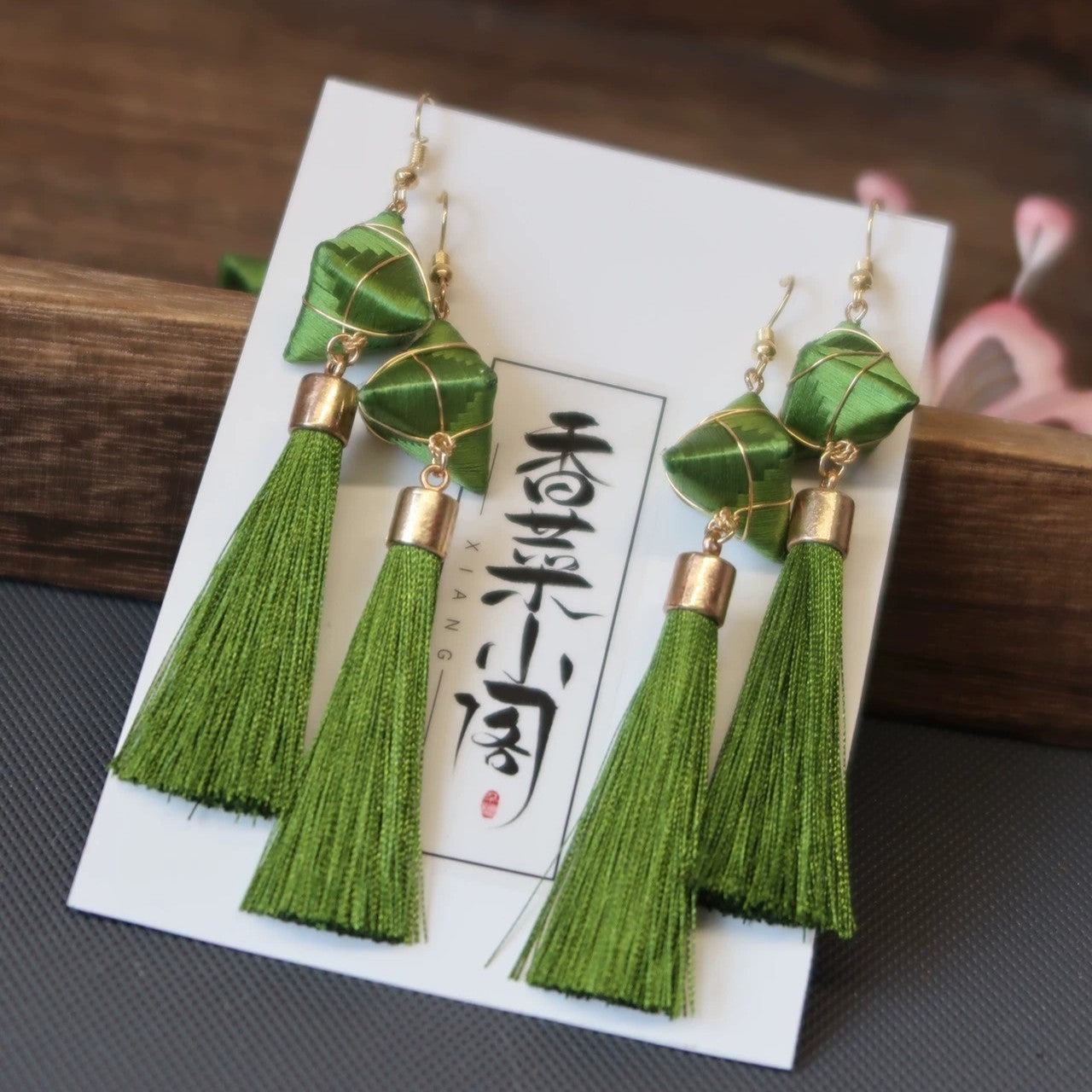 Pair of Zongzi-inspired green tassel earrings with 925 silver hooks, displayed on a card with Chinese characters.