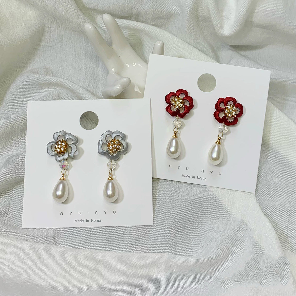 Pair of handcrafted Chanhua floral drop earrings with white pearls and S925 silver hooks, shown in red and silver variations.