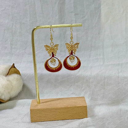 The Chanhua earrings displayed on a stand, highlighting the 925 sterling silver ear hooks.