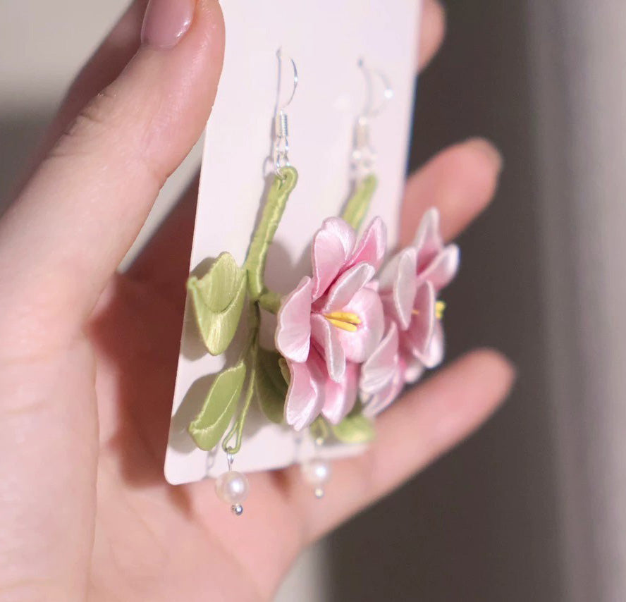 A pair of elegant handmade floral earrings with 925 silver hooks, suitable for everyday and party wear.