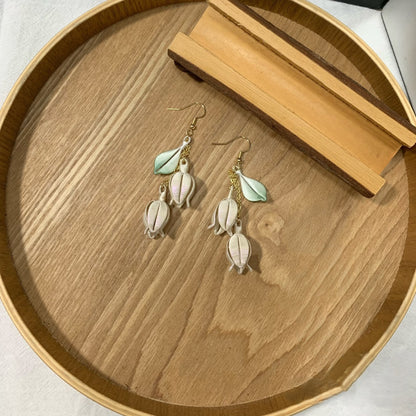 Handmade Chanhua lily of the valley earrings with thread bell flowers and green leaves, dangling floral drop earrings