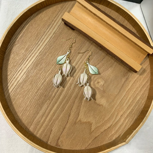 Handmade Chanhua lily of the valley earrings with thread bell flowers and green leaves, dangling floral drop earrings