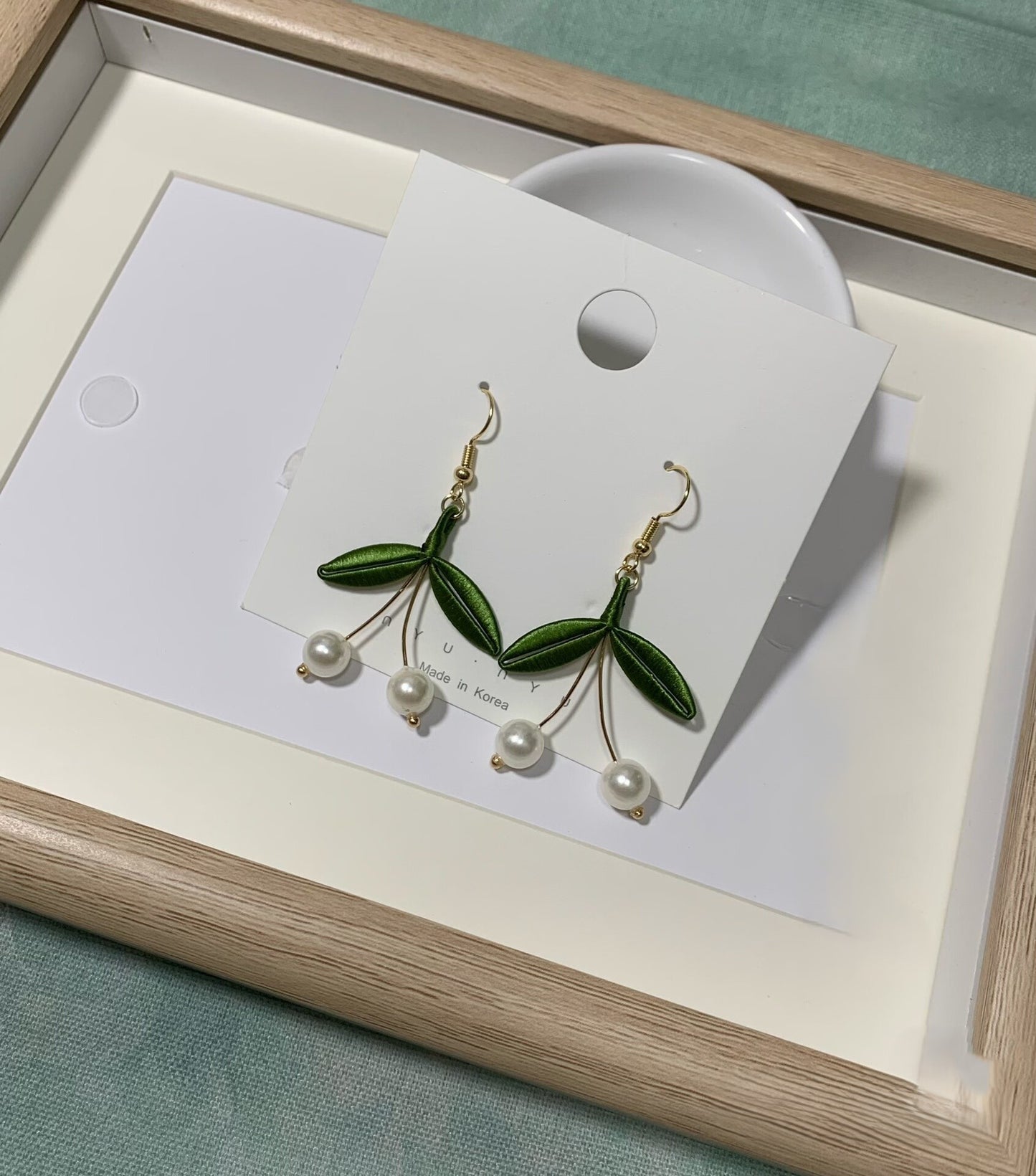 Handmade Chanhua cherry pearl earrings with green thread leaves and dangling white pearls, elegant floral drop earrings
