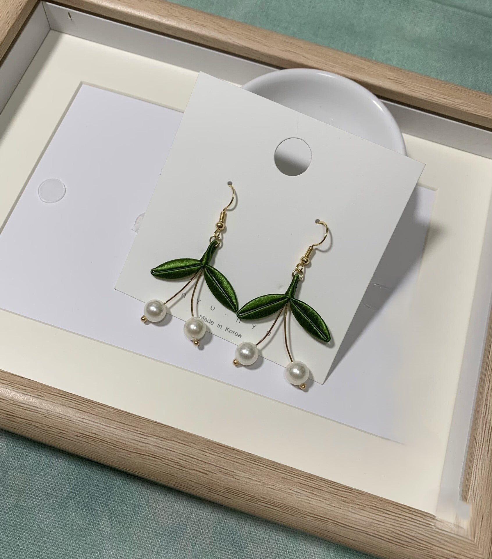 Handmade Chanhua cherry pearl earrings with green thread leaves and dangling white pearls, elegant floral drop earrings