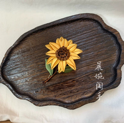 Handmade Chanhua sunflower brooch in yellow thread petals with brown center and green leaves, elegant floral lapel pin