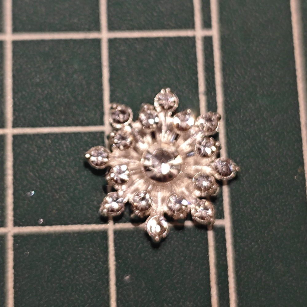 Close-up of Silver-Tone Flatback Snowflake Flower Center with Center Rhinestone (16mm)