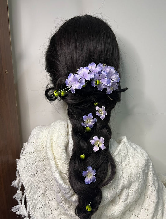 Handmade light purple mulberry silk Ronghua Crape Myrtle flower hair pin set styled in a long, dark braided hairstyle for a formal look.