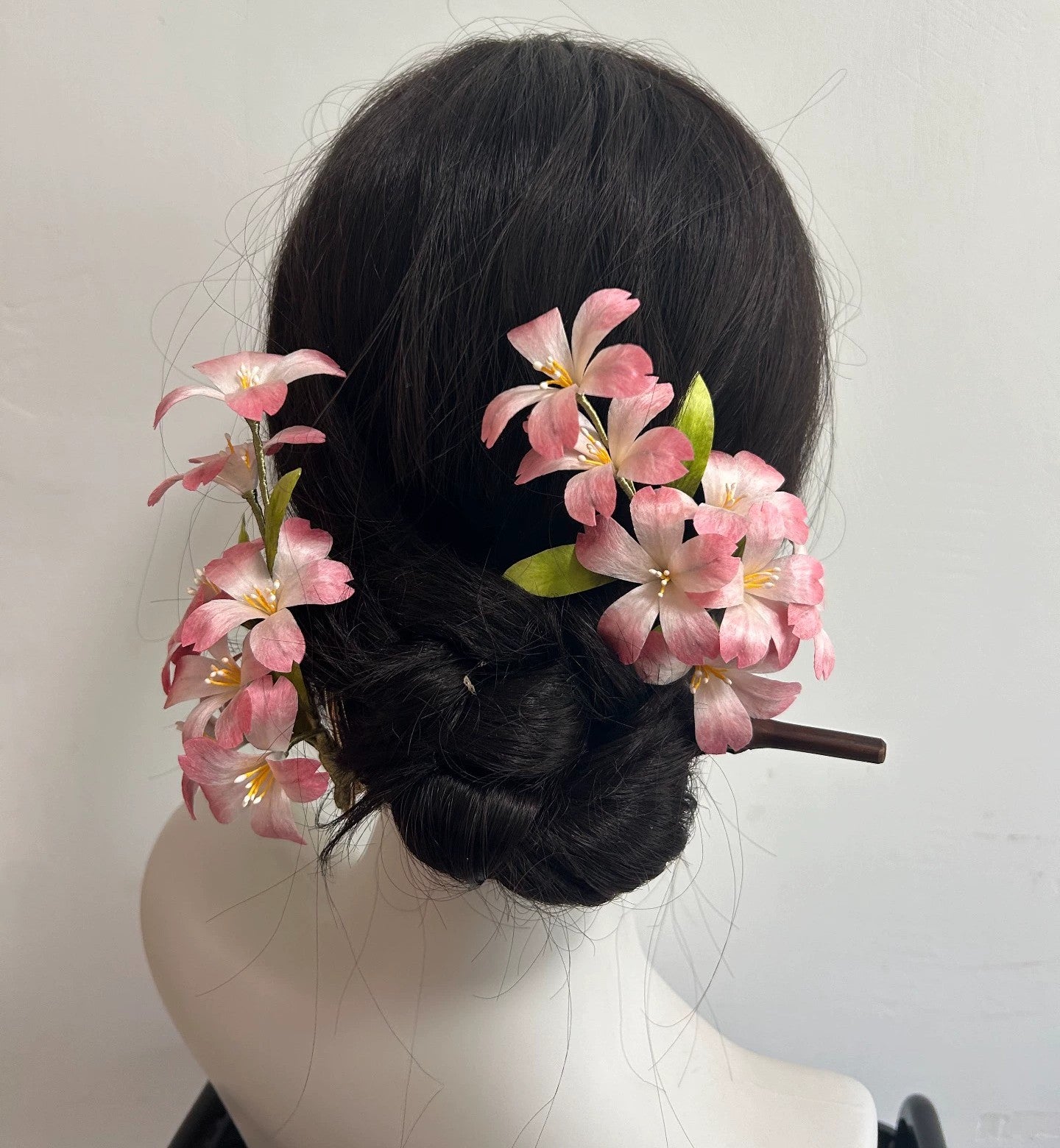 Close-up of the hand-stitched pink and white silk thread cherry blossoms, highlighting the natural mulberry silk texture.