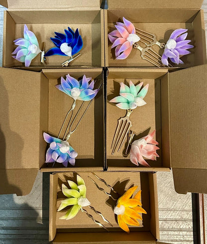 Handmade Ronghua nine-tailed fox hairpins in multiple colors (blue, pink, red, yellow) displayed in kraft boxes with various metal bases