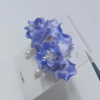 Handmade Ronghua blue iris drop earrings in mulberry silk velvet with pearl and gold chain, displayed on white background