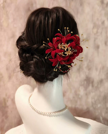Handmade Ronghua red spider lily hairpiece in mulberry silk velvet with gold stamen details worn in elegant low bun