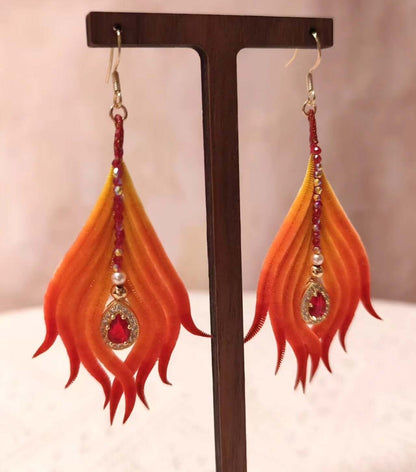 Handmade Ronghua phoenix tail feather earrings in red-orange mulberry silk velvet with crystal and pearl accents on gold hooks