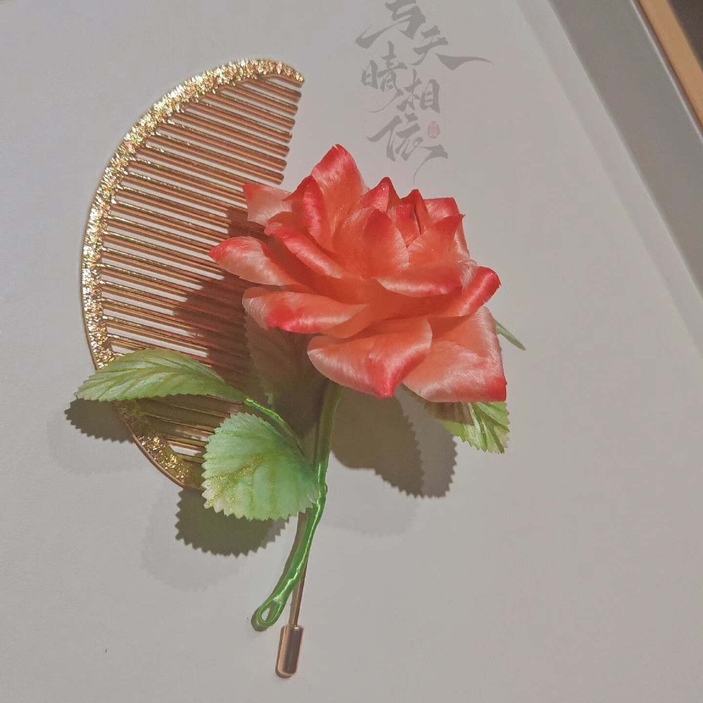 Handmade Ronghua red rose brooch in mulberry silk velvet with green leaves on gold-tone comb pin