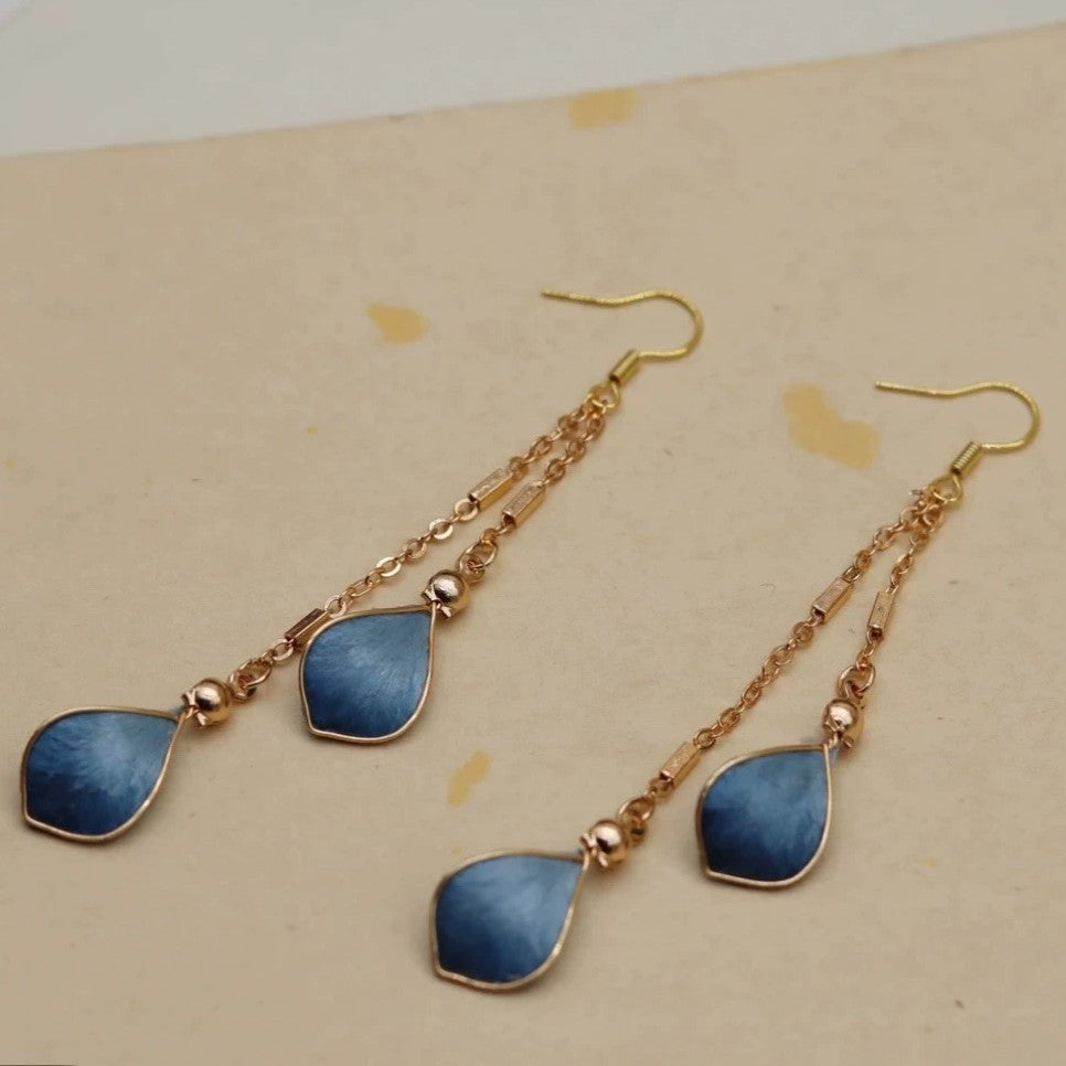 Handmade Ronghua blue waterdrop long drop earrings in mulberry silk velvet with gold chain on display