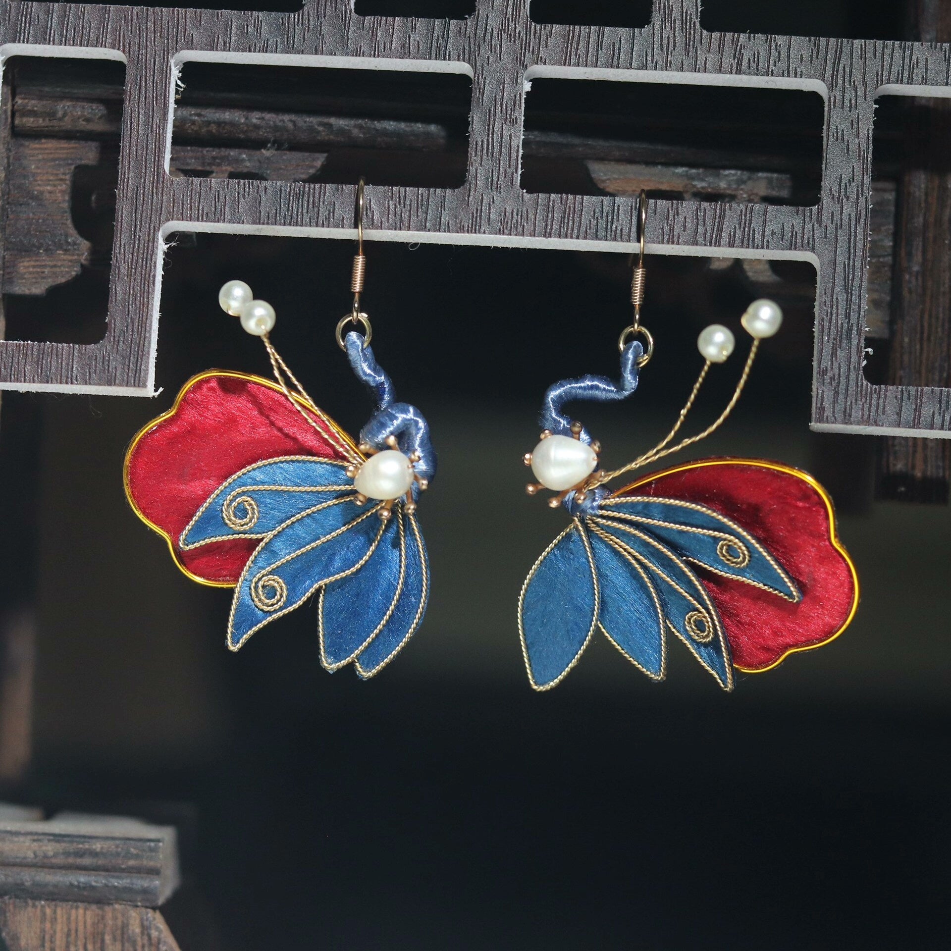Handmade Ronghua red and blue butterfly drop earrings in mulberry silk velvet with freshwater pearl body and gold details