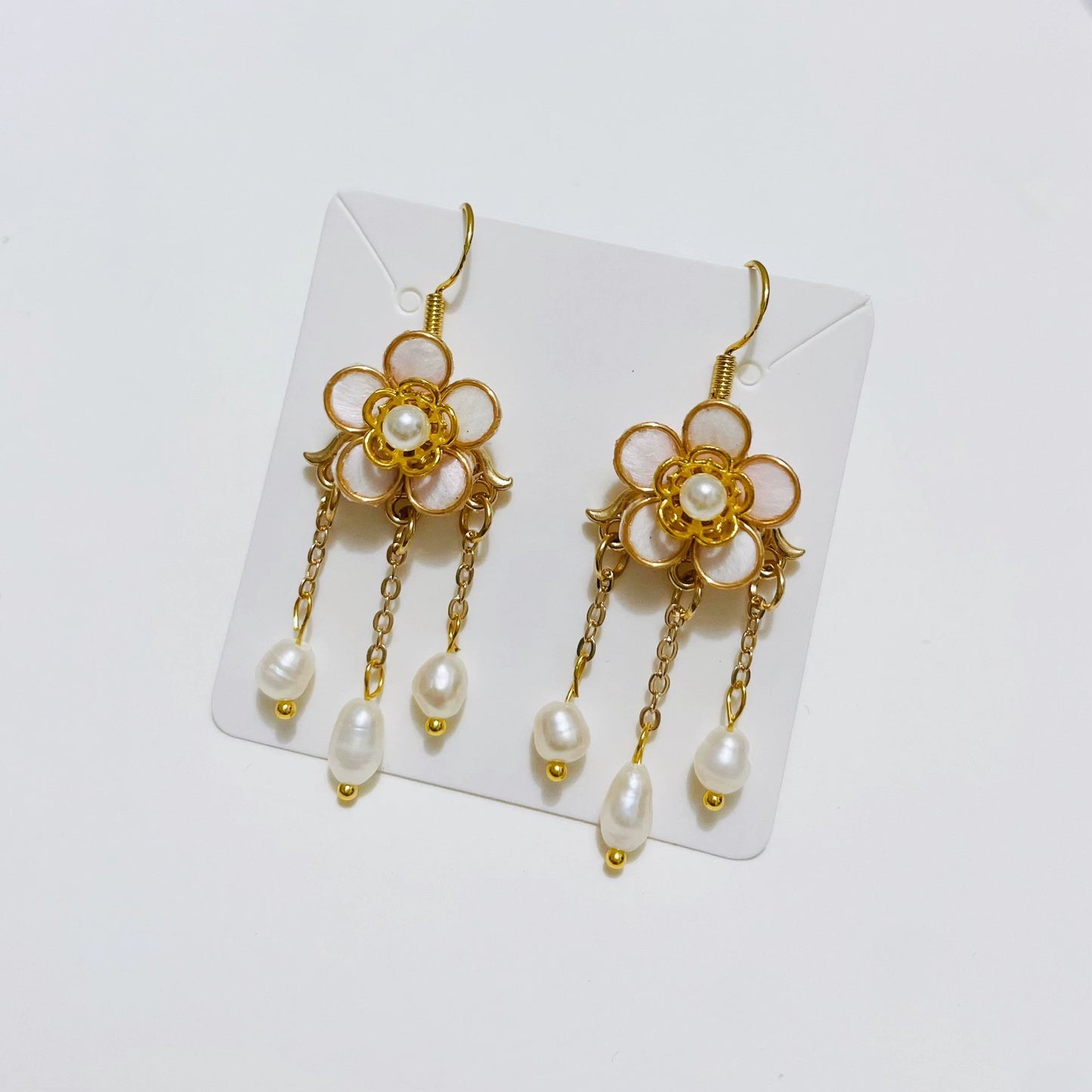 Handmade Ronghua pink plum blossom long tassel earrings in mulberry silk velvet with pearl center and gold chain drops