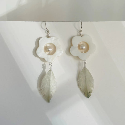 Handmade Ronghua white plum blossom drop earrings in mulberry silk velvet with mother-of-pearl frame, freshwater pearl, and green silk leaf