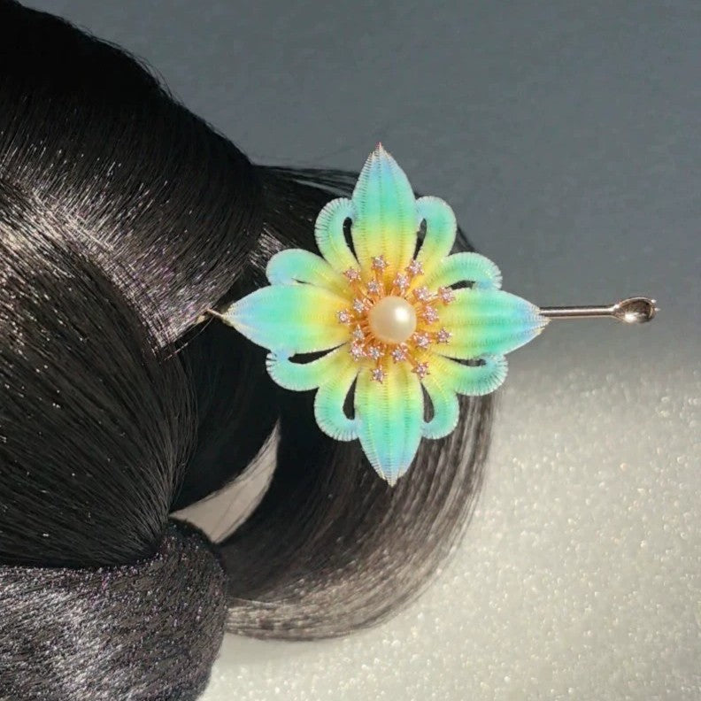 Handmade Ronghua Baoxiang flower hair stick in yellow-mint gradient mulberry silk velvet with pearl and crystal center worn in low bun