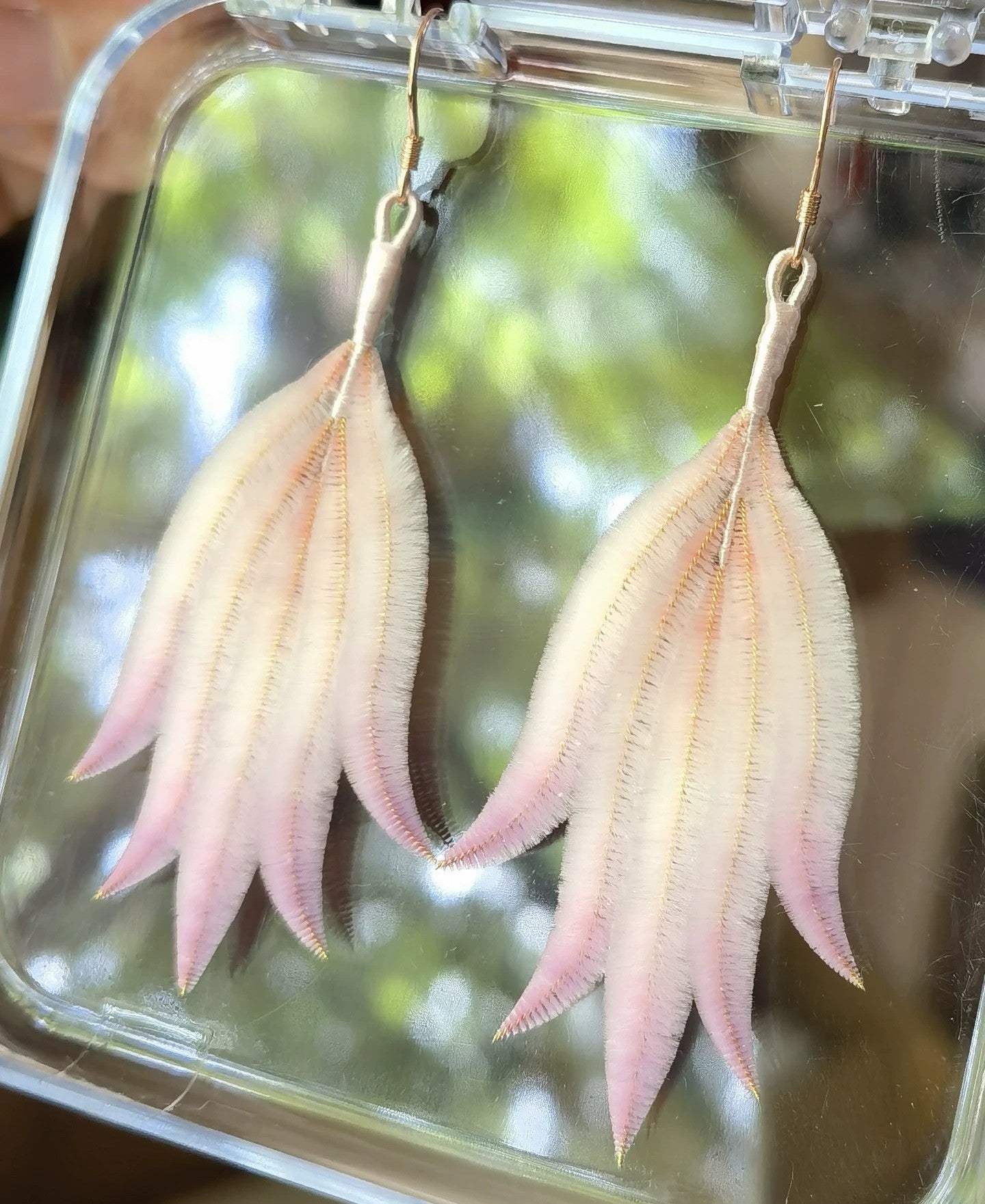 Light pink Ronghua feather drop earrings worn – lightweight mulberry silk statement earrings for hanfu and weddings