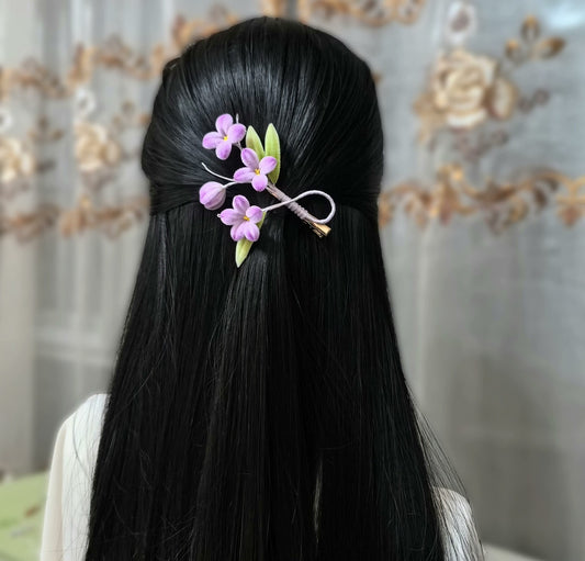 Handmade Ronghua purple lilac flower hair clip worn in black hair – natural mulberry silk velvet floral alligator clip